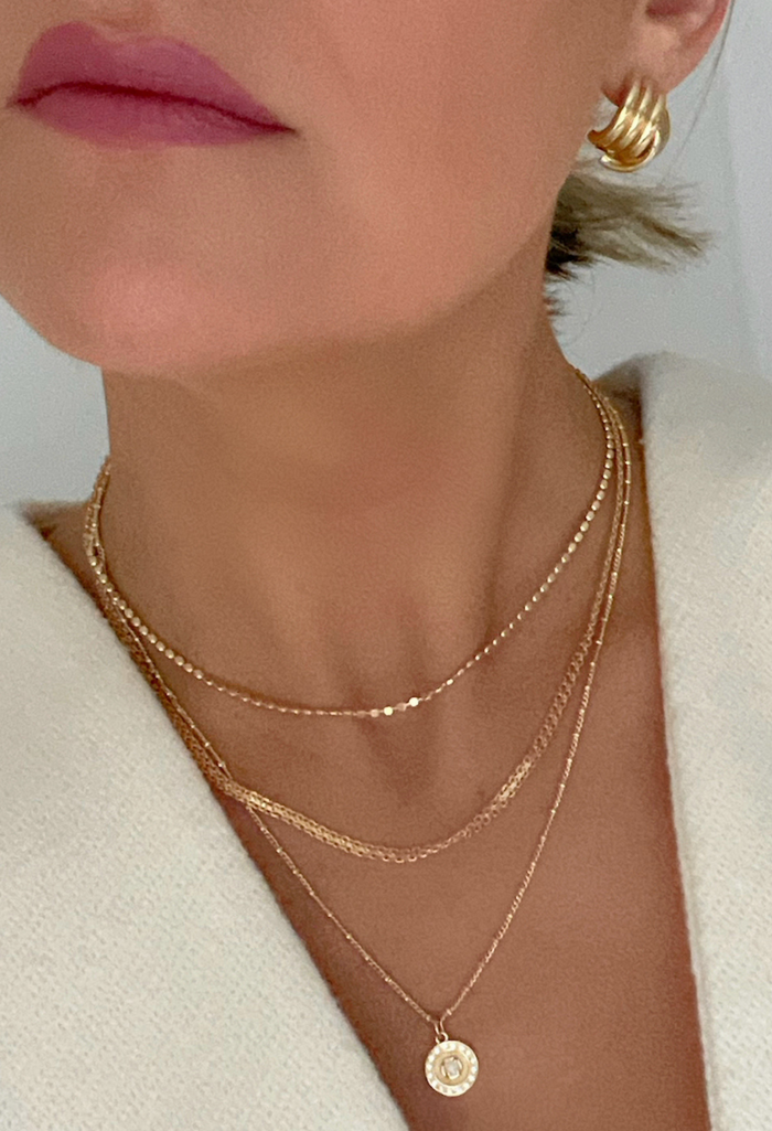 Shine bright with the Pixie Opal Coin Necklace—crafted in 18k Gold Filled and set on a tiny coin, this radiant piece adds effortless elegance to your everyday style.
