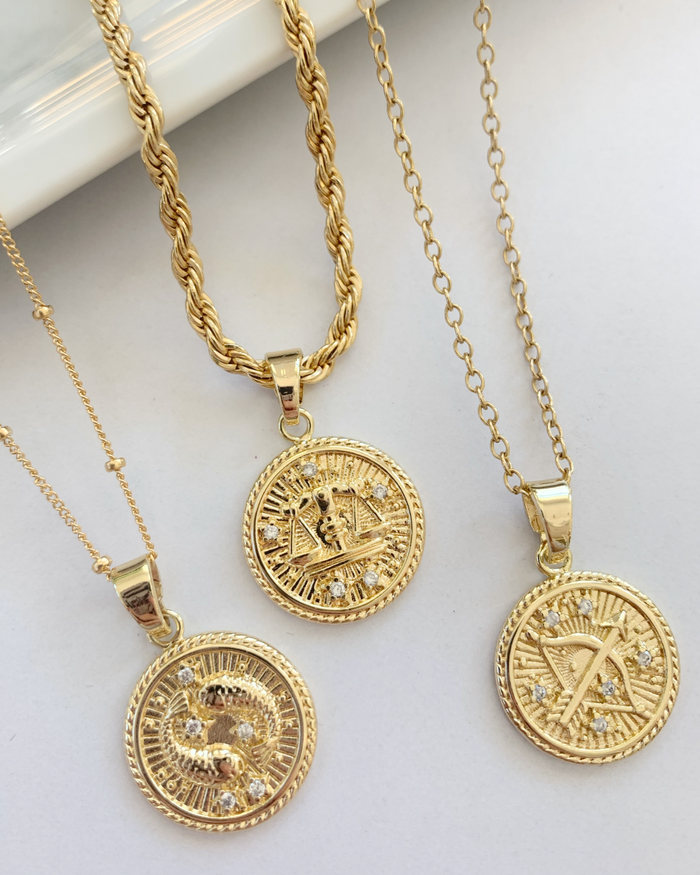 18k Gold-Filled Zodiac Coin Necklace – Celestial elegance for modern women. Versatile and empowering, a symbol of unique traits and timeless style. Product Image. 