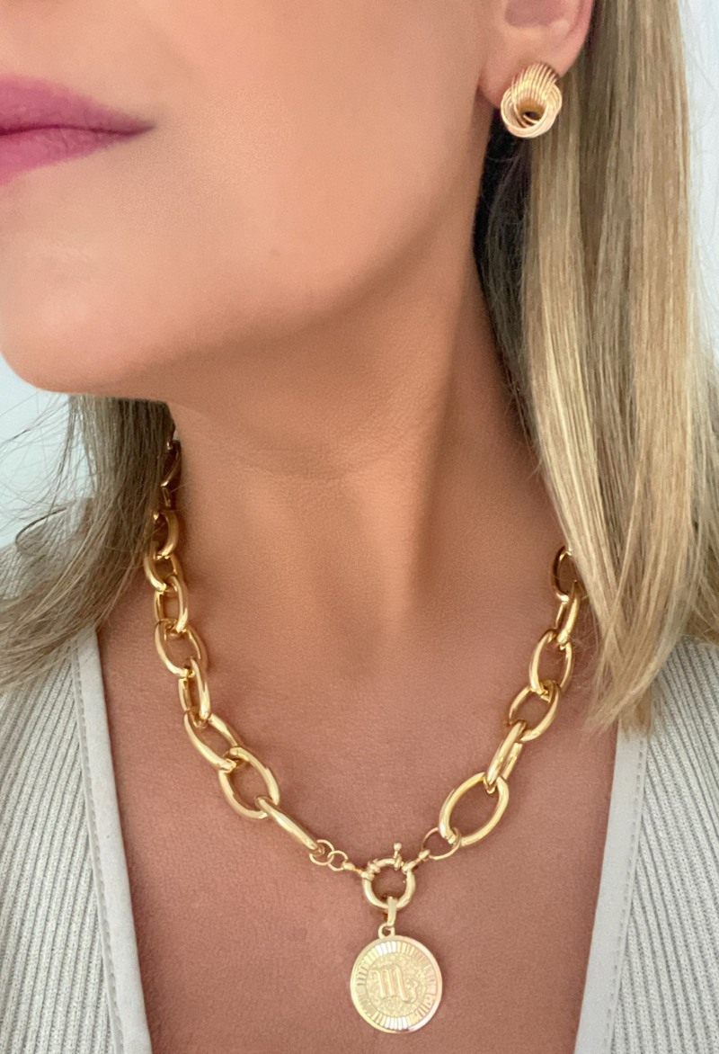 Elevate your everyday look with our Chunky Rolo Chain featuring a stunning zodiac coin. Crafted in 18k gold fill, this necklace is designed for the modern woman who loves versatile, statement pieces. Whether worn alone for a sleek, bold vibe or layered with your favorite chains, it’s the perfect blend of personal and chic.