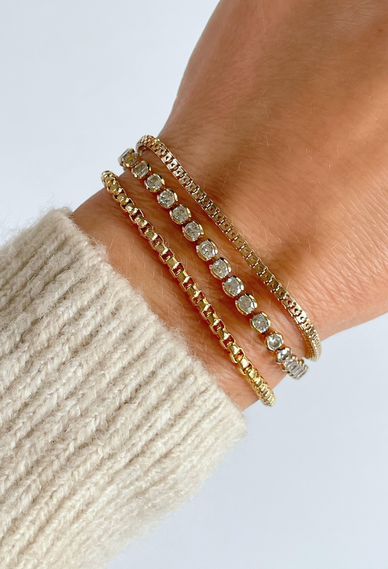 Introducing the 3mm Cruzette Tennis Bracelet—a perfect blend of timeless elegance and subtle sparkle. Whether worn solo or stacked with other pieces, this bracelet adds a touch of refined beauty that enhances your natural glow