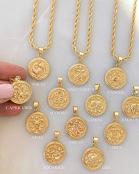 18k Gold Filled Zodiac Coin Necklace by Dylan Rae Jewelry, showcasing intricate zodiac symbols, customizable lengths, and various chain styles, embodying celestial elegance and personalized style.