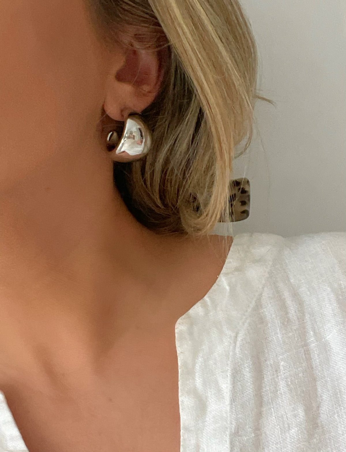Elegant Thick Dome Hoop Earrings by Dylan Rae Jewelry, available in gold and silver, showcasing their bold yet timeless design.
