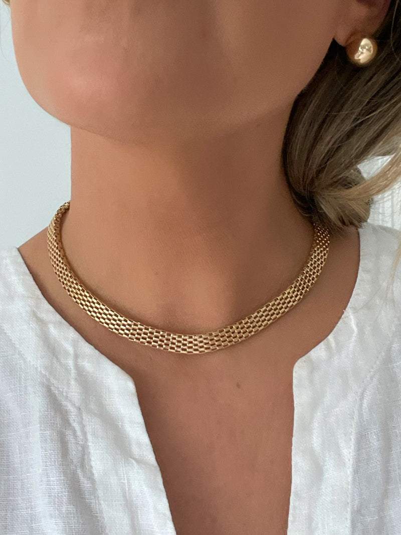 The Bismark Mesh Necklace by Dylan Rae Jewelry, showcasing its intricate 18k gold-filled mesh design.