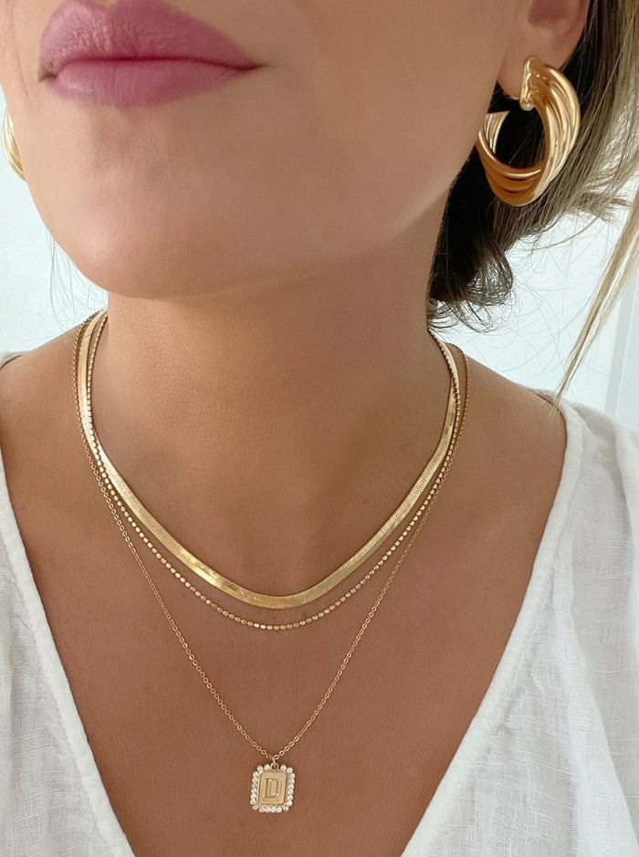 Multi Hoop Knot Earrings by Dylan Rae Jewelry, crafted in lustrous 18k gold filled, adding a contemporary twist to any outfit.