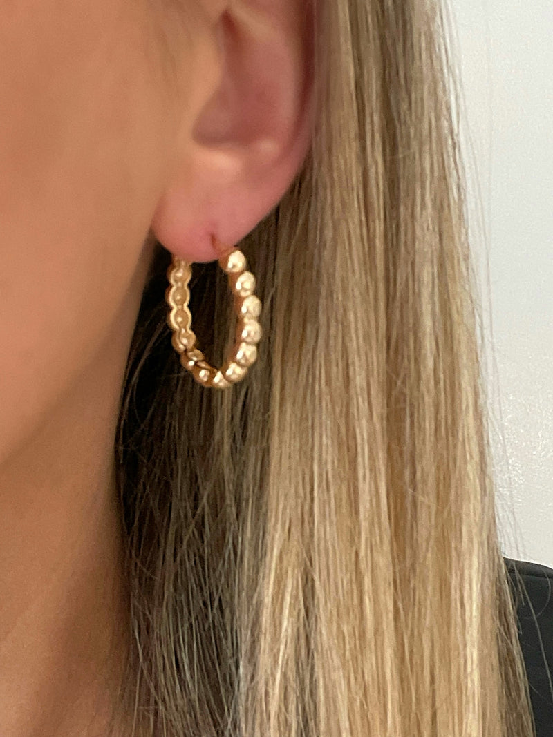 Handcrafted gold hoop earrings with intricate beaded detailing by Dylan Rae Jewelry