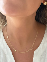 Gold necklace with 'mama' pendant, a heartfelt tribute to motherhood by Dylan Rae Jewelry