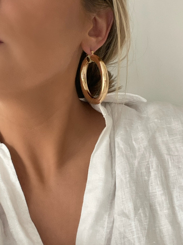 Large gold-filled tube hoops, versatile for everyday wear or layering with studs