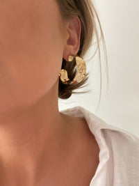 Lightweight Hammered Chunky Hoops - Gold earrings with hammered texture, showcasing chic sophistication.