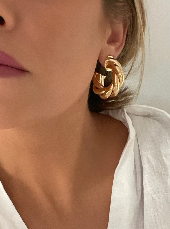 Chunky Thick Gold Hoop Earrings: Elevate your style with these bold, modern statement pieces. Their eye-catching design exudes confidence and allure, adding a touch of edgy sophistication to any outfit. Experience their substantial feel, a testament to their quality and durability. 