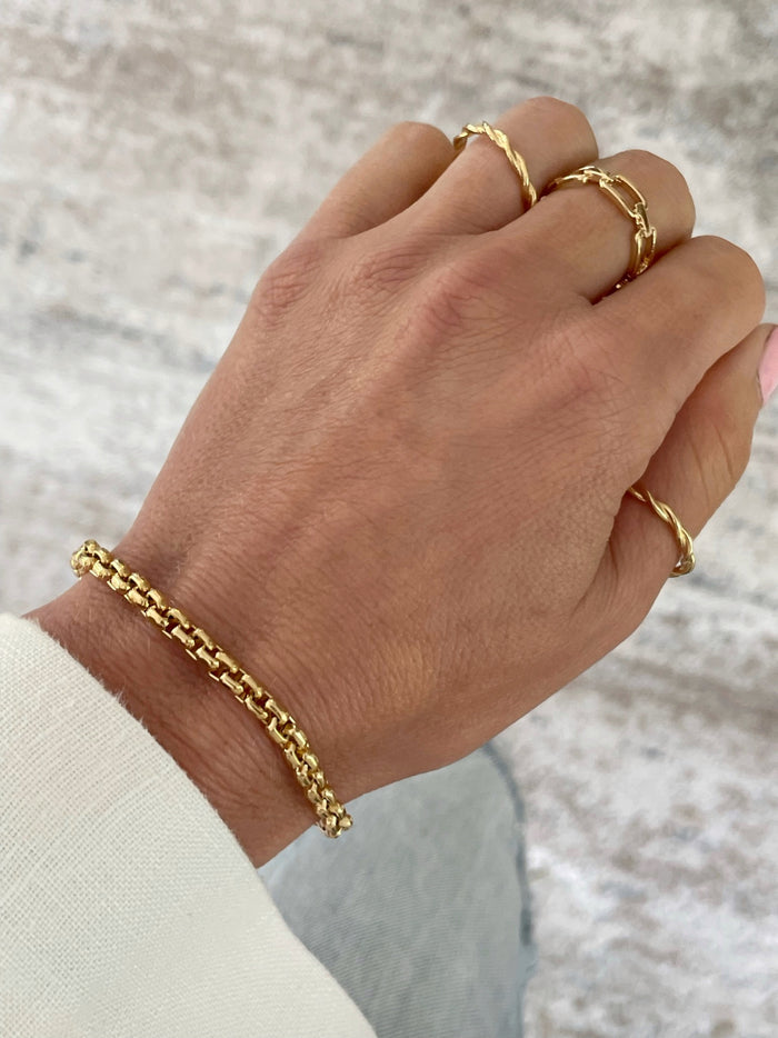 Sophisticated 18k Gold Box Bracelet by Dylan Rae Jewelry. Elevate your style with this modern, empowering accessory. Perfect for stacking or solo wear. Product photo on Model. 
