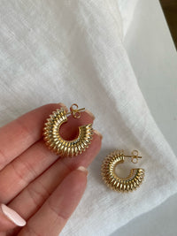 Image: Girls Night Out Chunky Hoops - Gold earrings with ribbed texture, perfect for bold elegance.