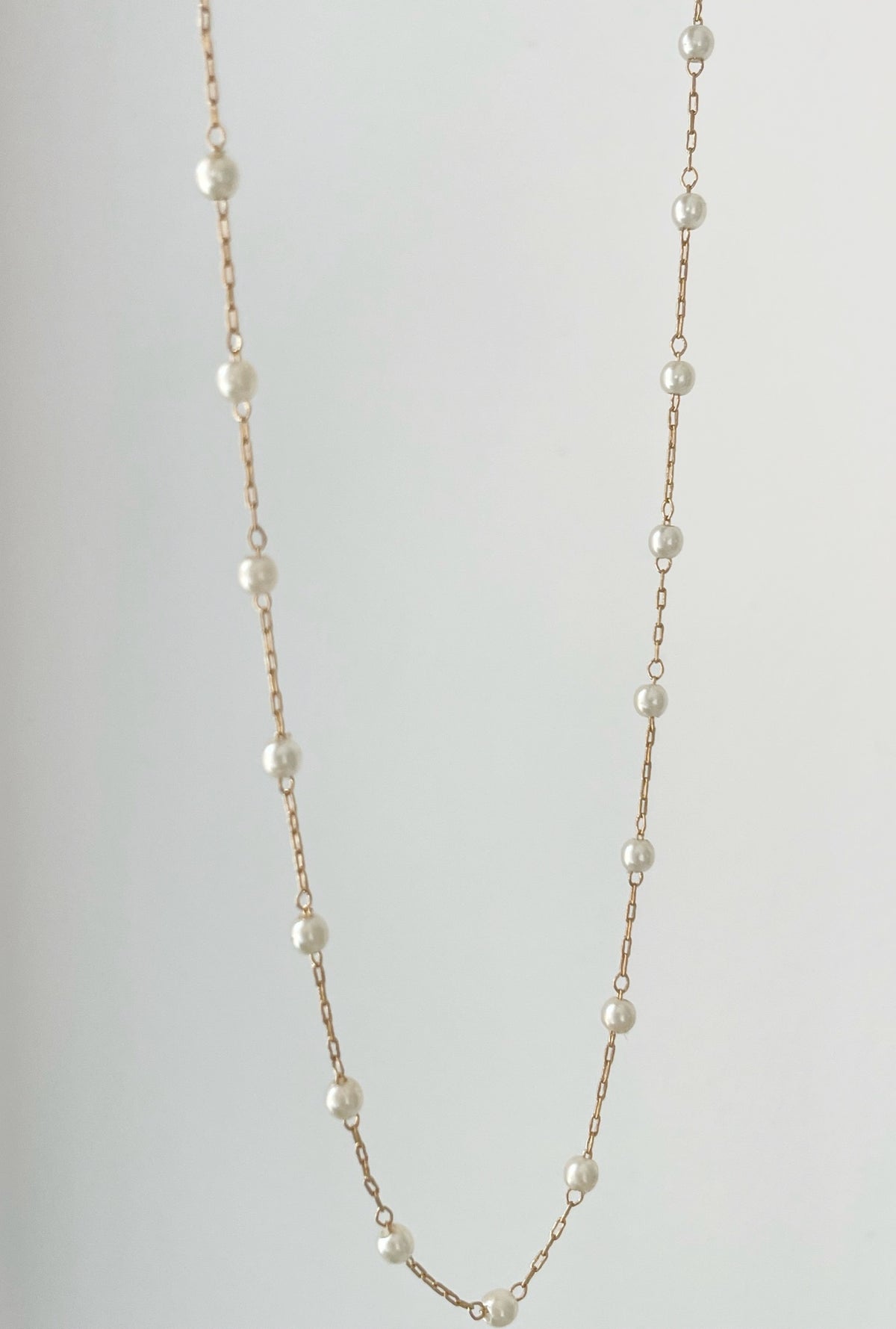 Pearl Chain Necklace by Dylan Rae Jewelry, showcasing delicate pearls on a gold-filled chain, exuding timeless elegance and versatility for any occasion.