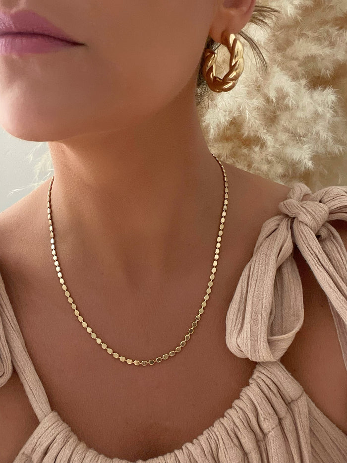Tulum Chain necklace by Dylan Rae Jewelry, featuring sleek flat disc ball design in shimmering 18k gold filled. 