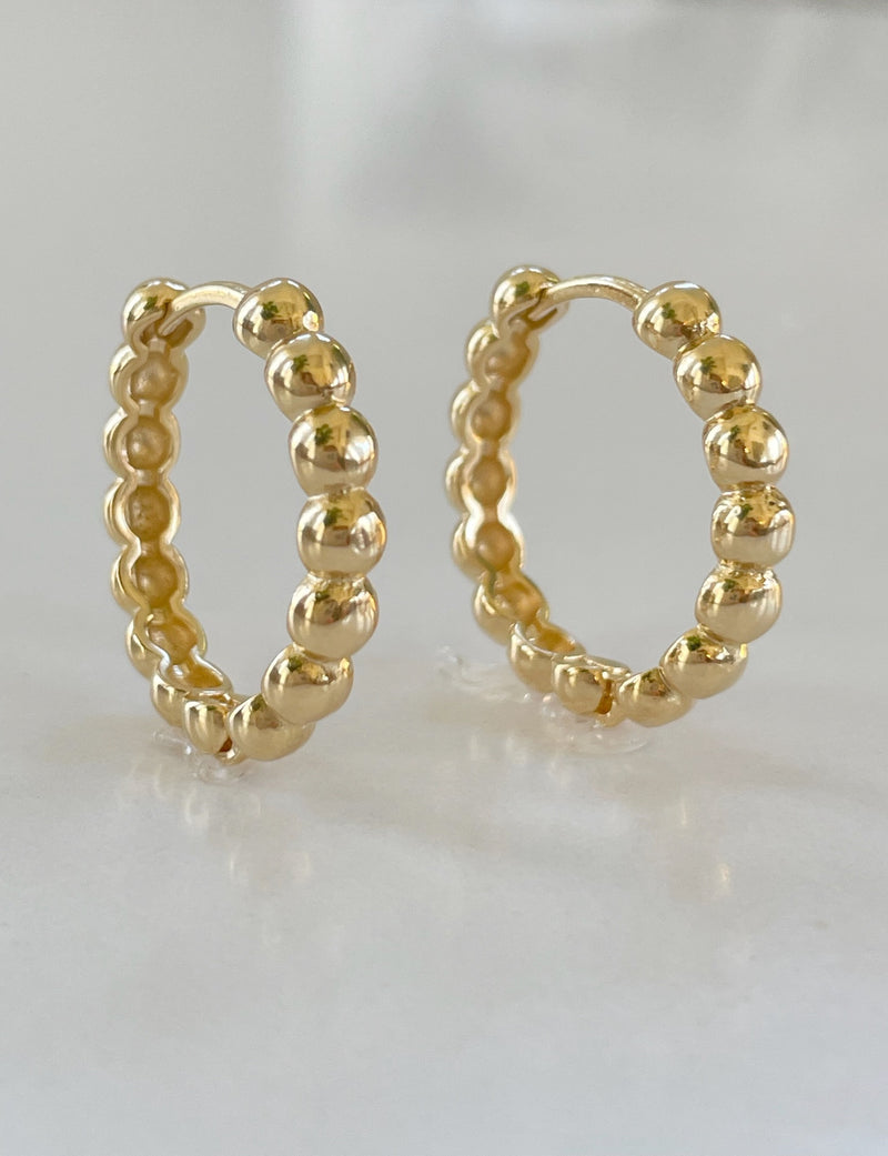 Handcrafted gold hoop earrings with intricate beaded detailing by Dylan Rae Jewelry