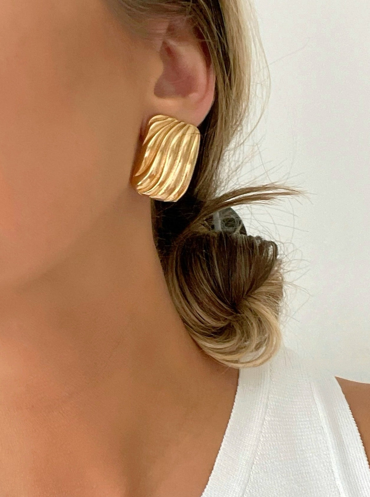 Gold-filled rectangle stud earrings, vintage-inspired design adding timeless elegance to any ensemble. 
