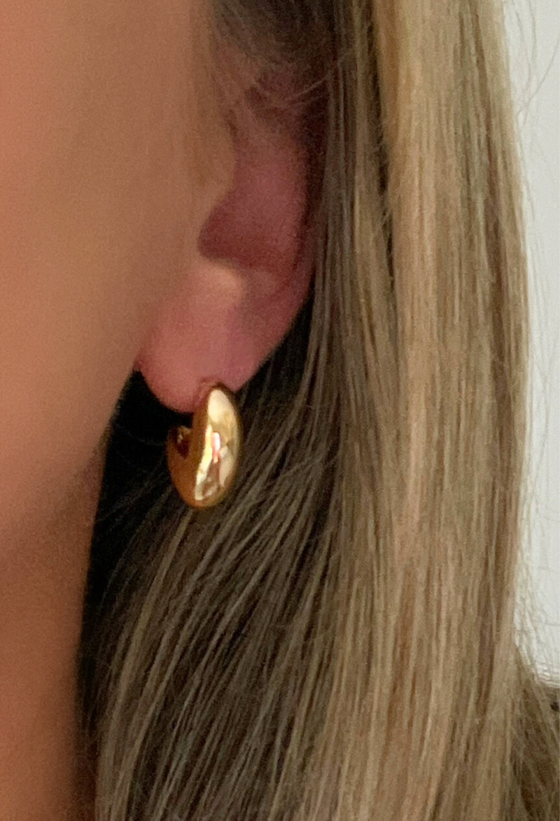 Discover the Teardrop Studs: sleek, versatile gold earrings designed to elevate everyday style and add a subtle statement to any look.