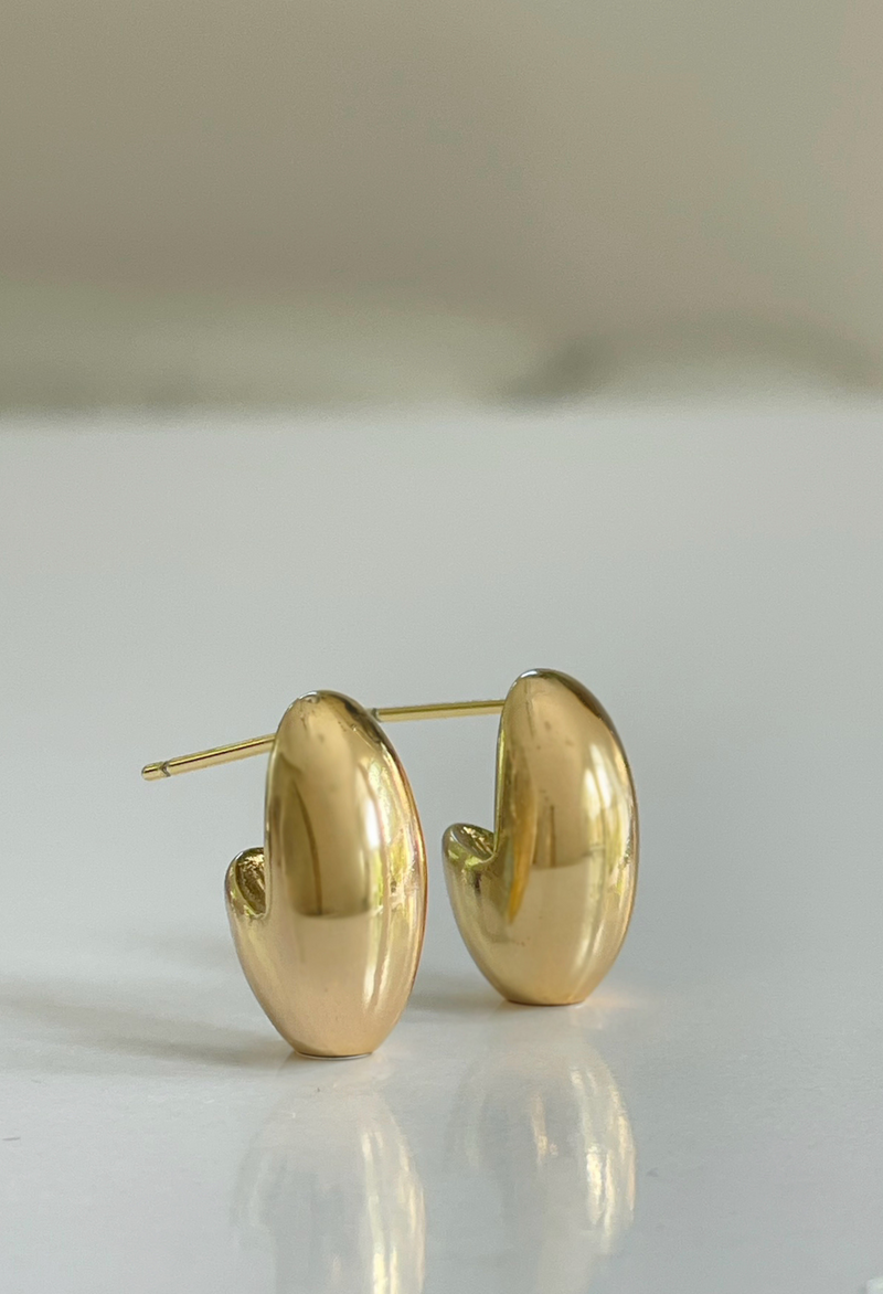 Discover the Teardrop Studs: sleek, versatile gold earrings designed to elevate everyday style and add a subtle statement to any look.