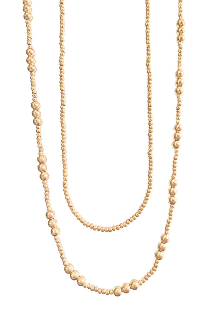 18K Gold Filled Ball Beaded Chains shining in the sunlight, ready to elevate your summer style.