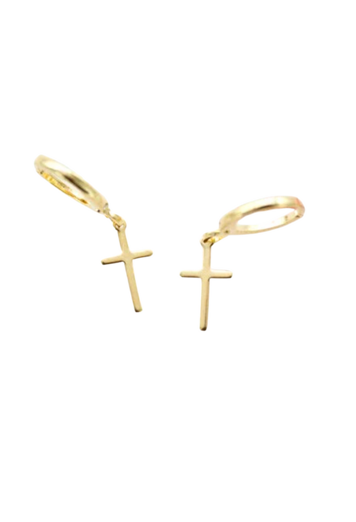 Image: Dainty gold cross huggie earrings, perfect for adding a touch of elegance to any ensemble.